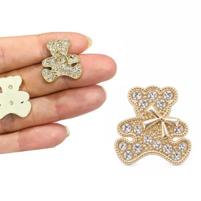 Aplique de Luxo em ABS Ursinho com Strass e Laço - Dourado
