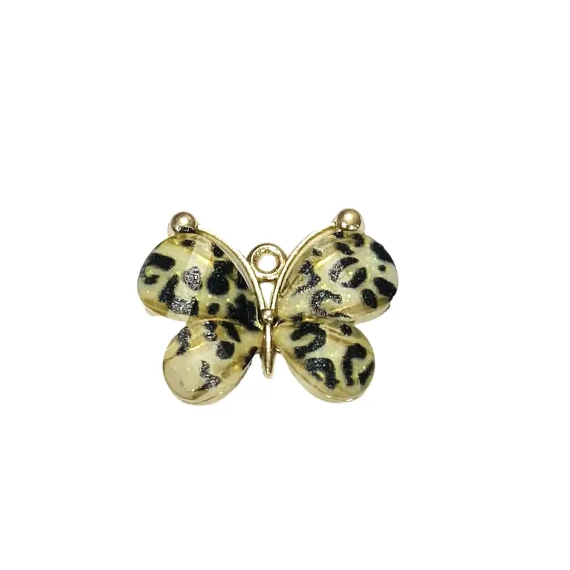 Pingente Borboleta de Metal com Strass 2,2cm X 3cm Marfim com Pintas Pretas